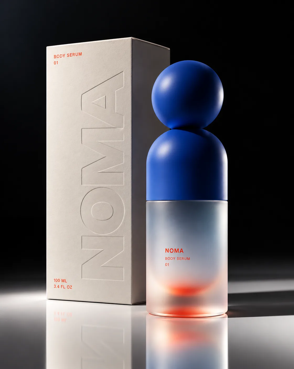 A frosted Noma serum bottle with a cobalt sculptural cap beside its embossed box
